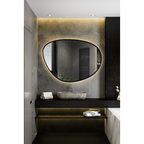 Unregelmäßig geformter Spiegel in einem Rahmen mit...